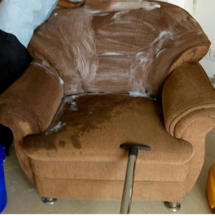 cleaning sofa with vacuuming
